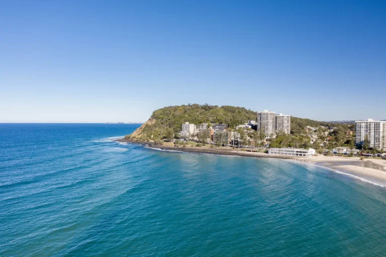 Burleigh heads on the gold coast with nice afternoon sun, gentle waves and beach lifestyle