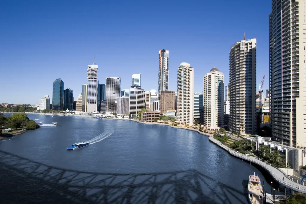 Ferry on brisbane river with Brisbane skyline in background