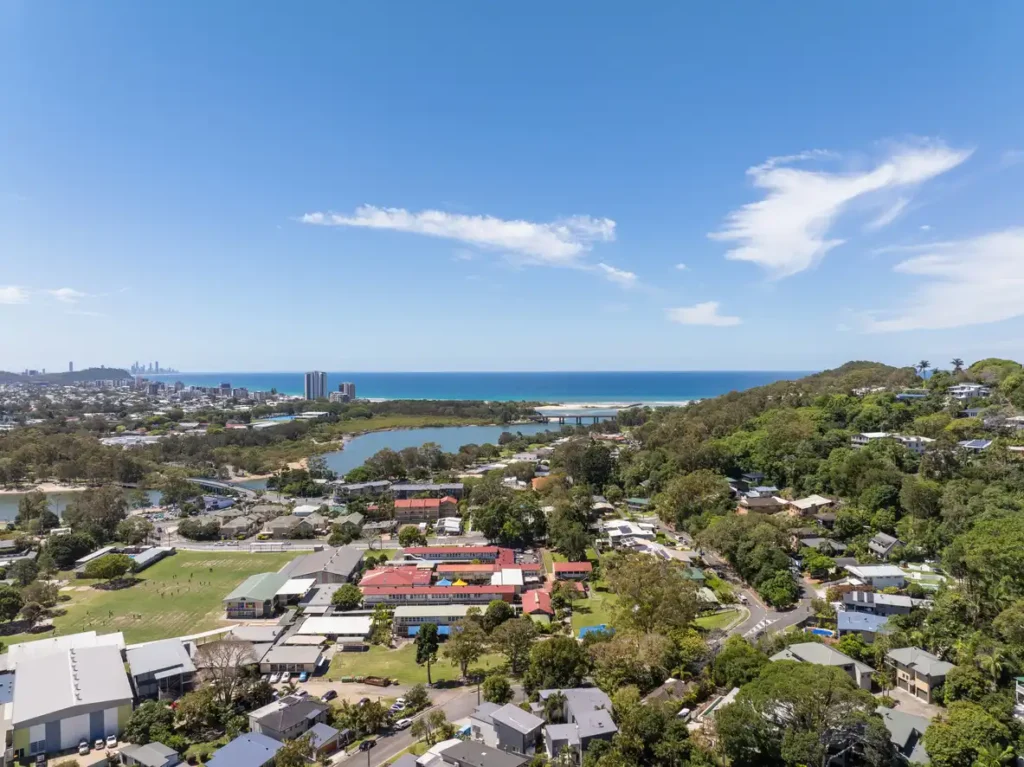 Aerial views over Currumbin Creek with the Estuary bridge, Thrower Drive bridge and the Currumbin Pedestrian Bridge M1 Pacific Motorway visible, Queensland, Australia
