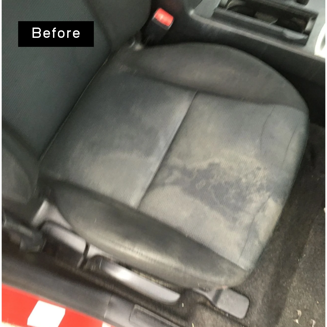 Dark fabric car seat with mould staining